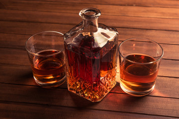 Glass and bottle with whiskey