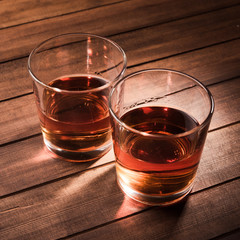 Whiskey drinks on wood table