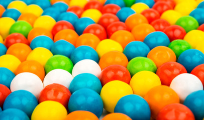 Fototapeta na wymiar many colored fruit gummy candies close-up