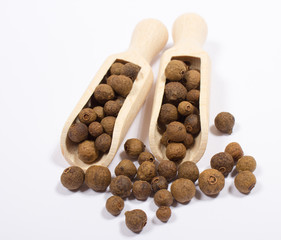 Grains of allspice isolated on white