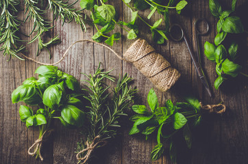 Mix of fresh herbs from garden on an old table