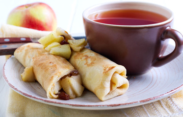 Crepes rolls with spicy apple and raisin filling