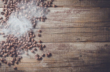 Overhead shot of coffee beans on an old wooden table