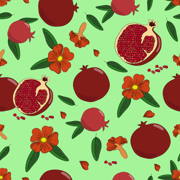 Seamless pattern. Juicy pomegranate with leaves and flowers.