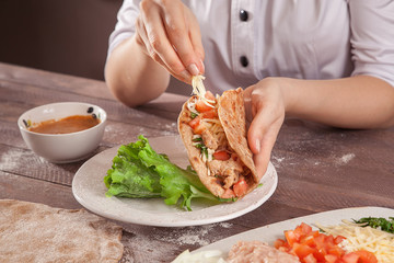 Chef hands stuffed tacos