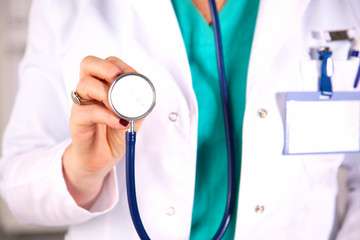 Portrait of happy medical doctor woman in office