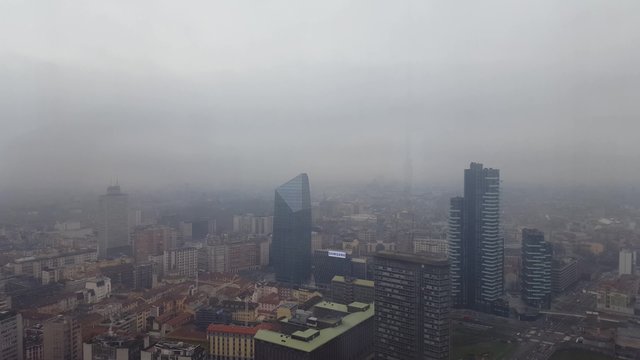 From the bottom to the top aerial panoramic view of Milan skyline with office bilding and apartment