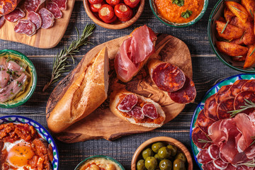 Typical spanish tapas concept, rustic style,  top view. - obrazy, fototapety, plakaty