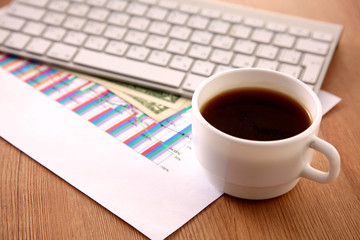 Office table with blank notepad and laptop 