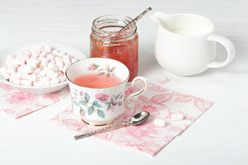 Watermelon Jam, Herbal Tea, Marshmallows. White Wooden Table