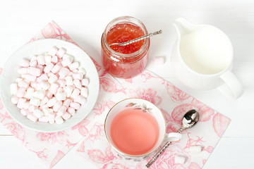 Watermelon Jam, Herbal Tea, Marshmallows. White Wooden Table
