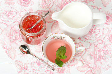 Watermelon Jam, Herbal Tea, Marshmallows. White Wooden Table