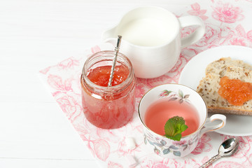 Watermelon Jam, Herbal Tea, Marshmallows. White Wooden Table