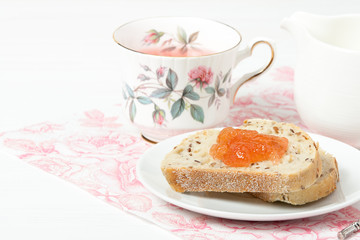 Watermelon Jam, Herbal Tea, Marshmallows. White Wooden Table