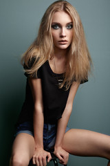 Portrait of young beautiful girl with blonde hair