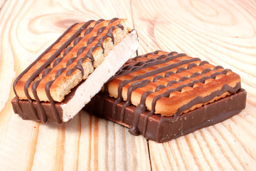zephyr cookie with chocolate on wooden background