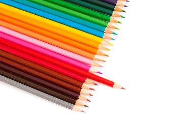 Fototapeta premium Set of crayons with pulled red pencil, isolated on white background