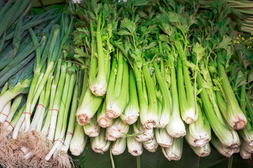 Fresh big celery and onion for sell in the fresh market at count
