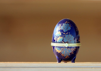 Easter egg in a box. Decoration for feast of Easter. Abstract background. Schedule an egg.