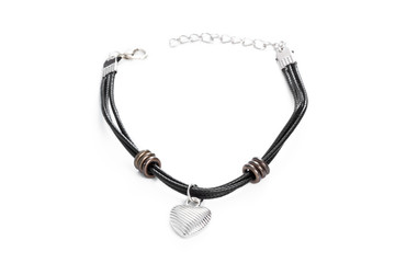 Fototapeta premium Leather bracelet and stainless cameo shaped heart
