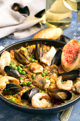 Traditional seafood paella in the pan