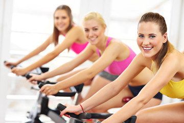 Sporty women on spinning class