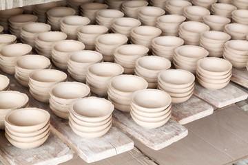 Ceramic cup in rack  prepare for bring in furnace in factory