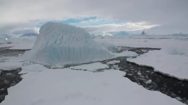 Ice and small icebergs floats on the ocean surface in the Antarctica. Amazing beautiful views of Nature and landscape of snow, ice and white of Antarctic. Global Warming.