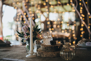 decorations made of wood and wildflowers served on the festive table