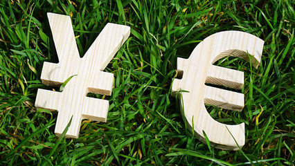 Exchange currency unit on a grass background