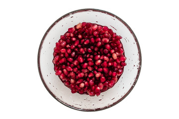 Berries of a pomegranate in water on a white background