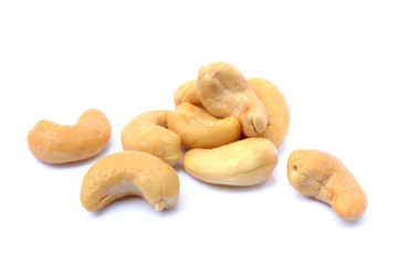 Peeled salted cashews isolated on a white background