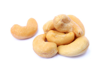Peeled salted cashews isolated on a white background