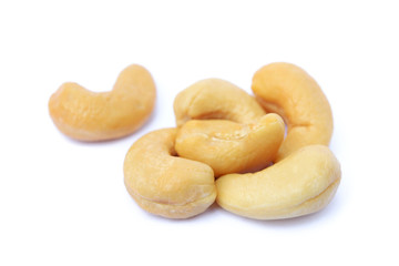 Peeled salted cashews isolated on a white background