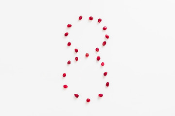 Berries of a pomegranate in the form of eight to the Women's Day