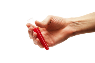 Laboratory test tube with red liquid in a hand