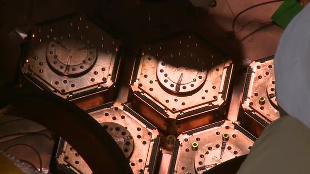 At the Fermilab National Accelerator Laboratory, scientists work on high energy particle physics.
