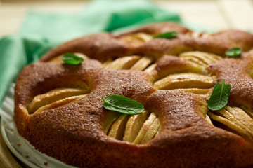 Homemade apple cake with mint leaves