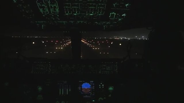 Point of view of a commercial airplane taking off at night.