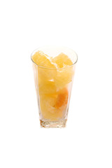 Pomelo and tangerine slices citrus in long glass with water drops isolated toned