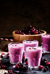 Pink smoothies with milk, black currants and cranberries, fresh