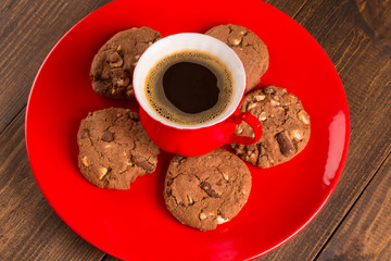 Coffee cup and amaretti biscuits on wooden background. top view