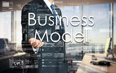 Fototapeta na wymiar Businessman presenting text Business Model on virtual screen.
