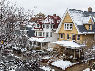 NEW YORK, USA, on MARCH 4, 2016. A house view from the window in Brooklyn on the street and trees...
