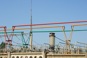 Electrical power high voltage substation encircled with barbed wire fence