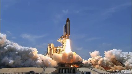 The Space Shuttle Lifts off from its launchpad. - Powered by Adobe