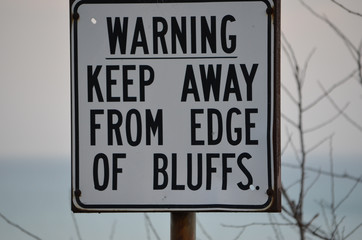 Warning sign for edge of bluffs on Lake Ontario, Toronto, Canada