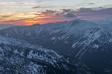 Colorful mountain sunset panorama at winter in Western Tatras