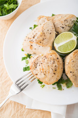 Chicken breasts with parsley and citrus top view. Healthy food.