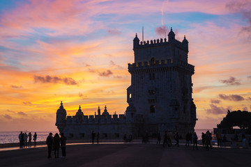 Tower of Belem ( Torre de Belem ) with beautiful burning fire sky at sunset, Lisbon, Portugal. Listed on UNESCO World Heritage Site.